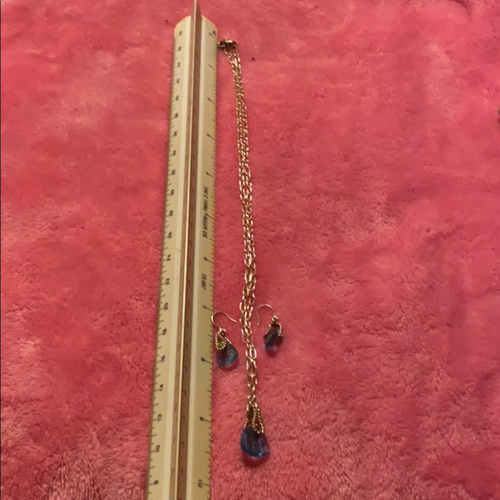 Silver and blue stone with matching earrings.